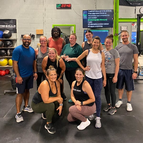 group of adults posing at a CrossFit gym in London Ontario